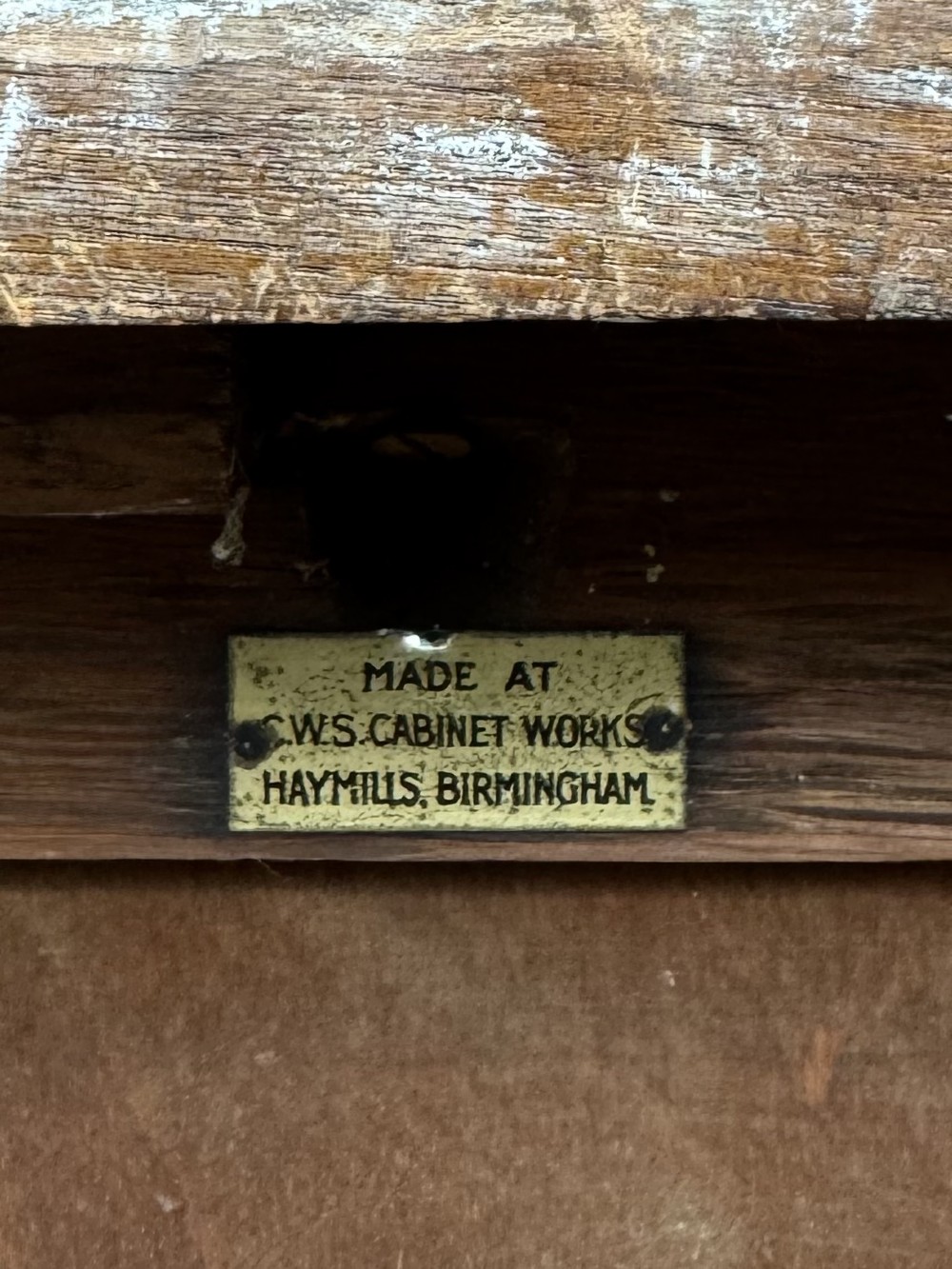 A 20th-century mahogany chest of drawers featuring three straight drawers with string inlay borders, brass ring handles, and square tapered legs. View XII