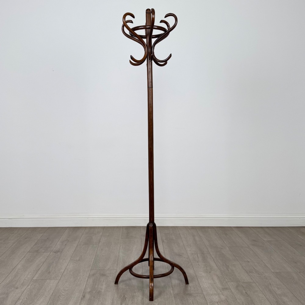 A tall dark brown beech bentwood coat stand featuring multiple curved hooks at the top and a circular quadruped base. View II