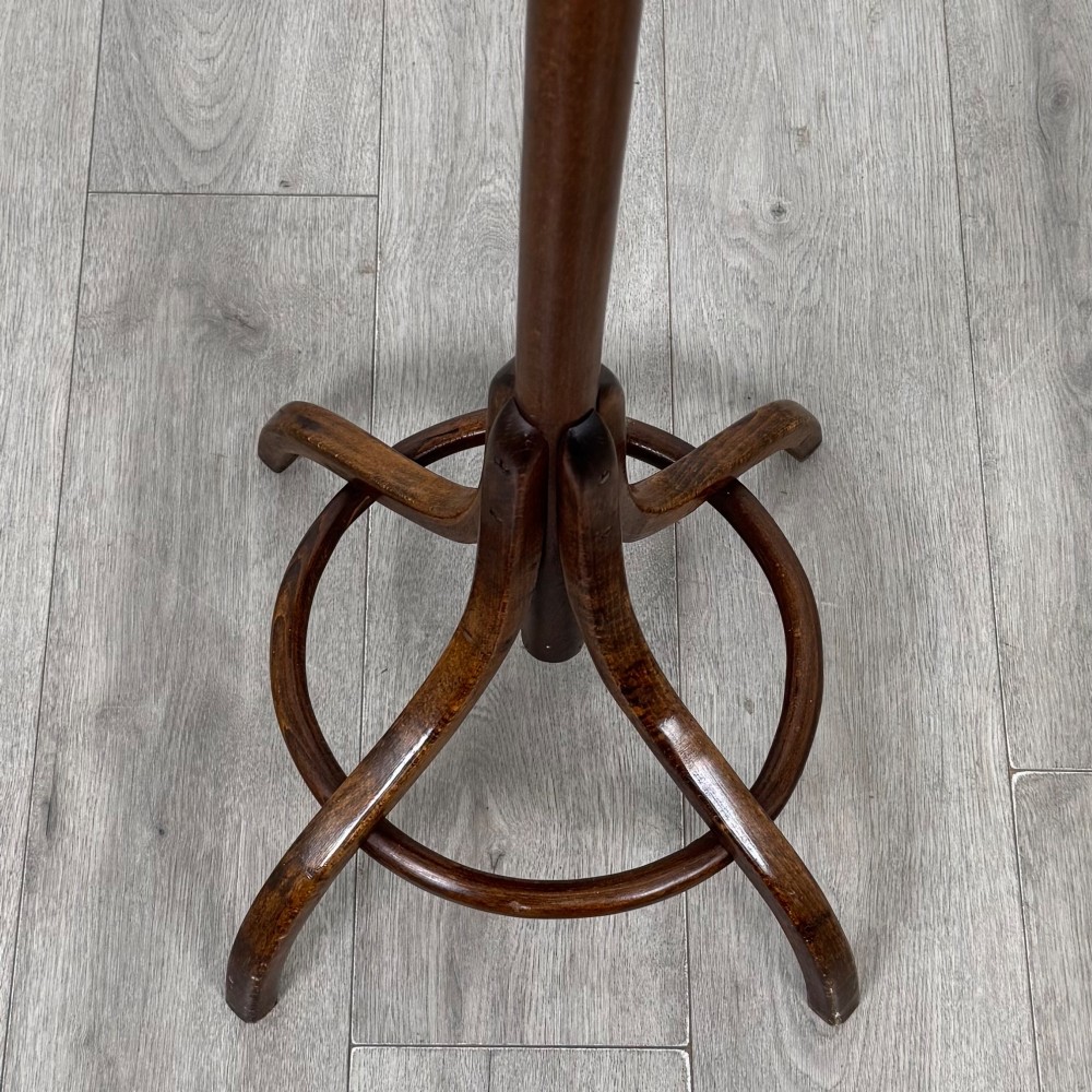 A tall dark brown beech bentwood coat stand featuring multiple curved hooks at the top and a circular quadruped base. View III