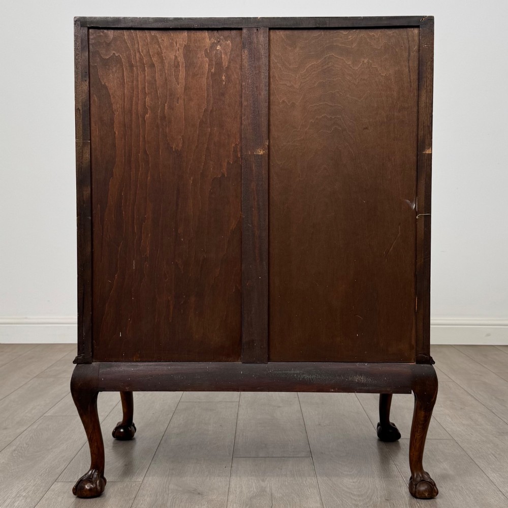 An antique Edwardian figured walnut writing bureau with a slant-front lid, three long drawers, brass handles, and carved cabriole legs on claw-and-ball feet. View VI