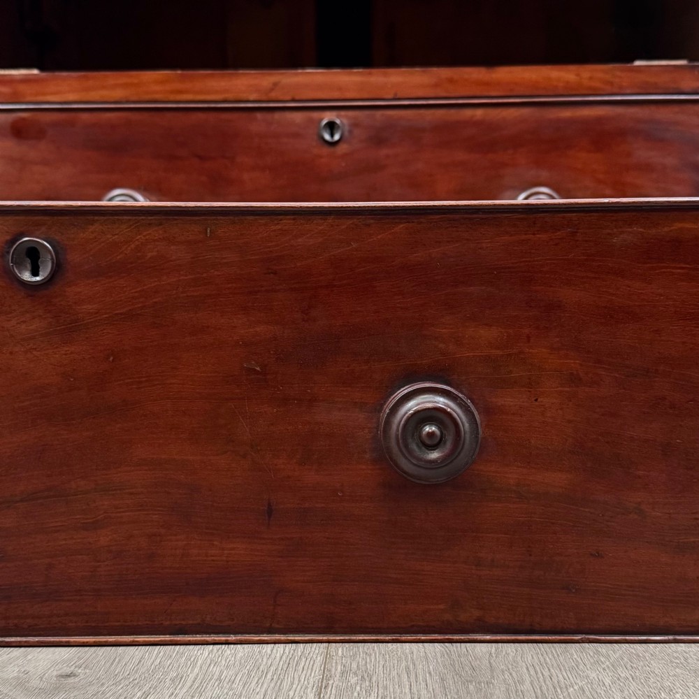 A Victorian dark mahogany chest of drawers featuring two short drawers above two full-width long drawers with turned wooden knobs and a solid plinth base. View XI