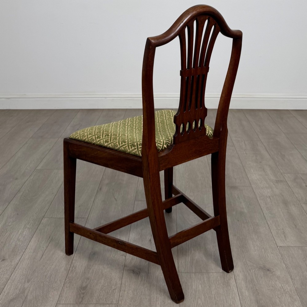 A set of four 18th-century Georgian mahogany dining chairs featuring pierced vertical back splats and green patterned drop-in seats. View III