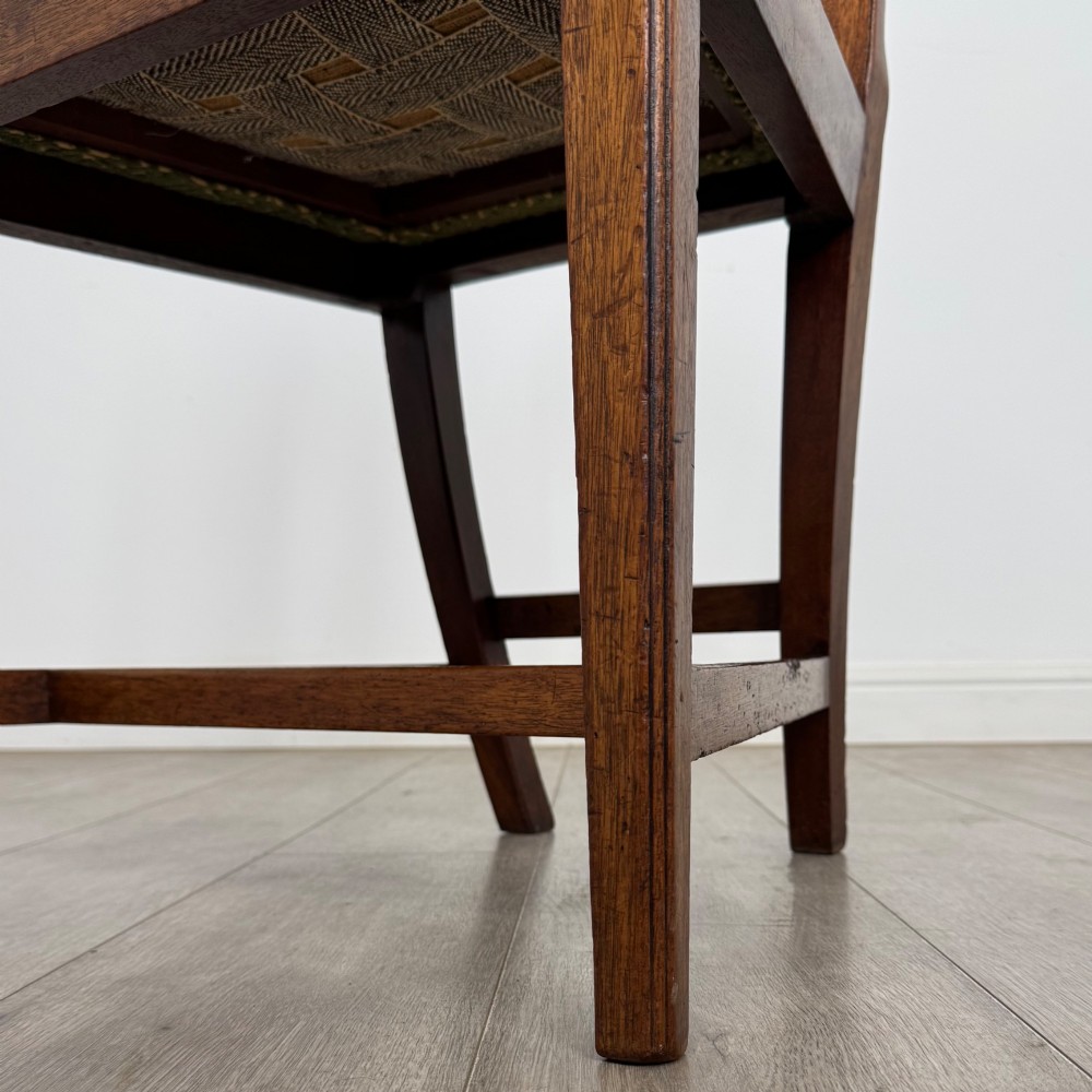 A set of four 18th-century Georgian mahogany dining chairs featuring pierced vertical back splats and green patterned drop-in seats. View VI