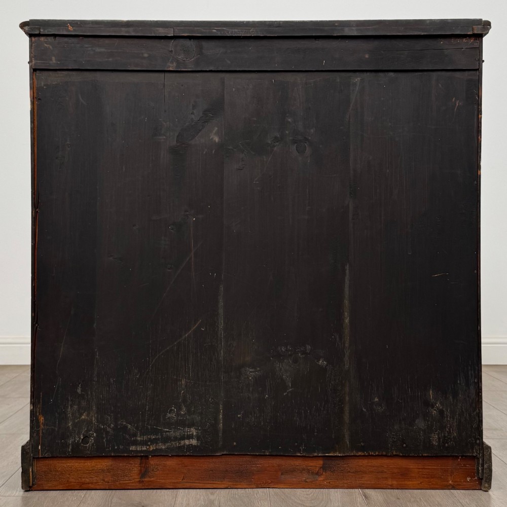 A 19th-century Victorian burr walnut pier cabinet featuring two glass panel doors, brass mounts, marquetry inlay, and a plinth base. View VI
