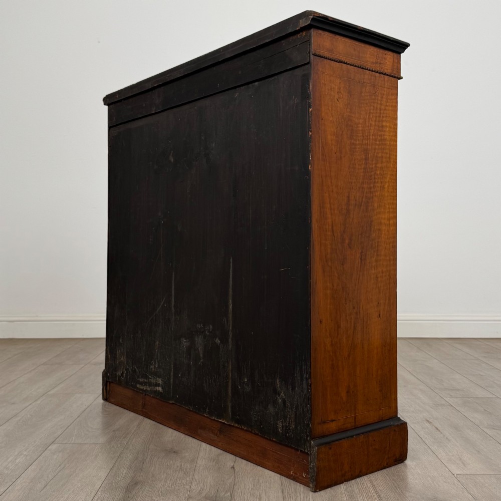 A 19th-century Victorian burr walnut pier cabinet featuring two glass panel doors, brass mounts, marquetry inlay, and a plinth base. View VII
