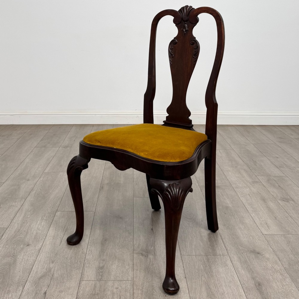 A set of six dark mahogany dining chairs featuring cabriole legs, carved back splats, and gold velvet drop-in seats. View III