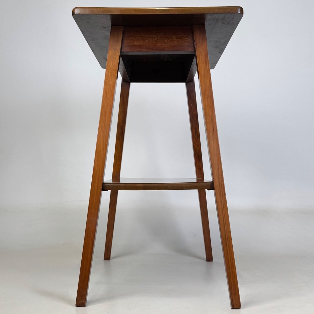 An Edwardian walnut side table featuring square apron framing, four splayed tapered legs, and an integrated lower undertier shelf. View III