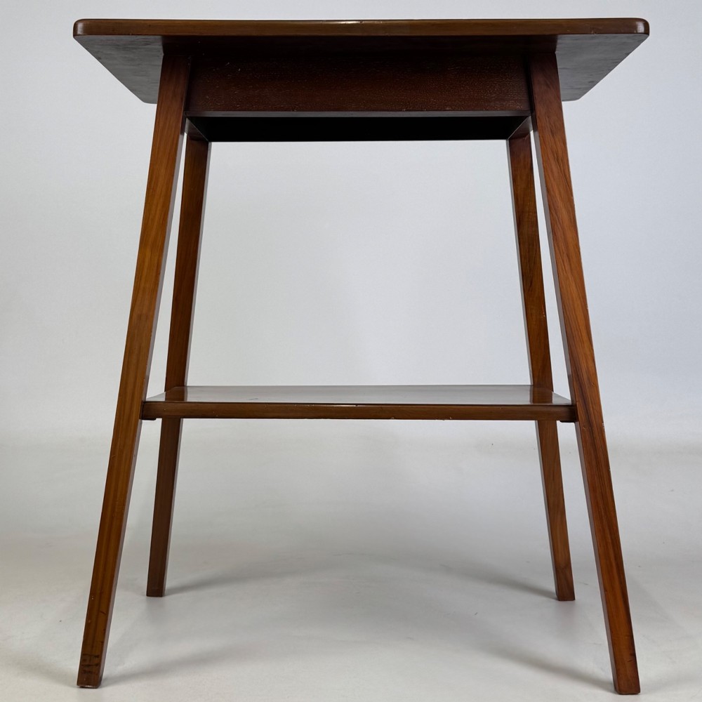 An Edwardian walnut side table featuring square apron framing, four splayed tapered legs, and an integrated lower undertier shelf. View V