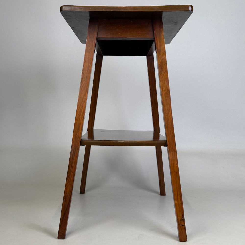 An Edwardian walnut side table featuring square apron framing, four splayed tapered legs, and an integrated lower undertier shelf. View VII