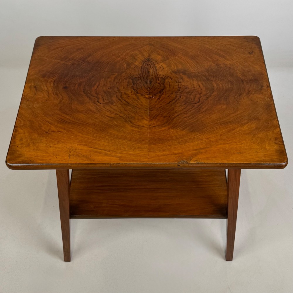 An Edwardian walnut side table featuring square apron framing, four splayed tapered legs, and an integrated lower undertier shelf. View IX