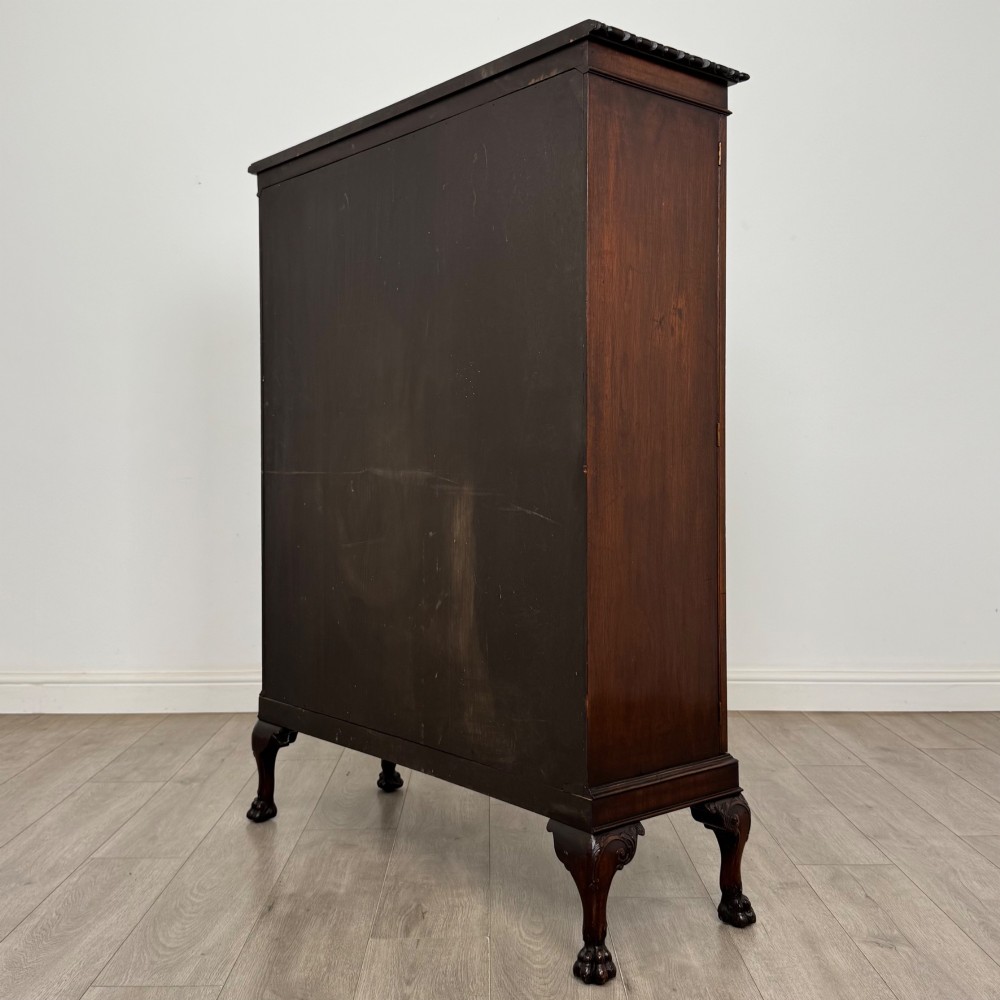 An Edwardian dark mahogany display cabinet featuring double astragal glazed doors and cabriole legs with carved claw and ball feet. View VII