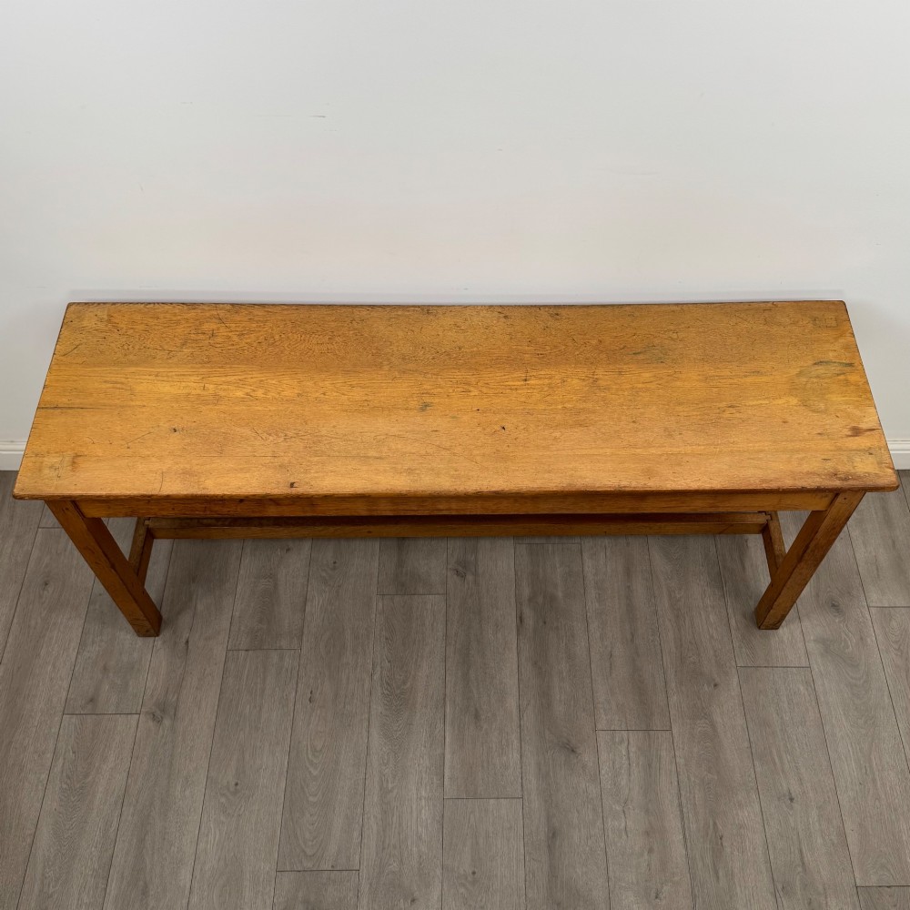A long 20th century oak side table featuring a plain rectangular top, four square legs, and a low central stretcher. View IX