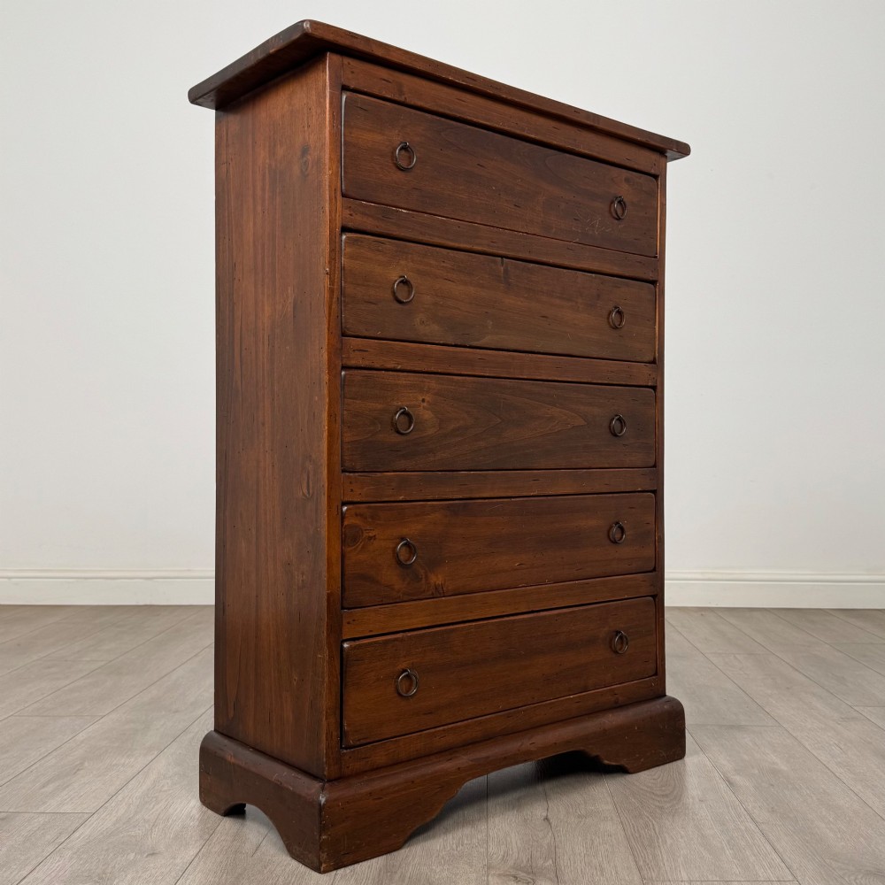 A tall dark brown hardwood chest of drawers featuring five horizontal drawers fitted with metal ring pull handles. View VIII