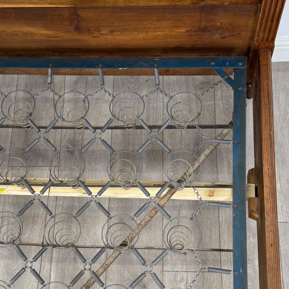 A 19th-century French oak double bed frame featuring a raised panelled headboard and footboard flanked by fluted posts with turned finials. View VII