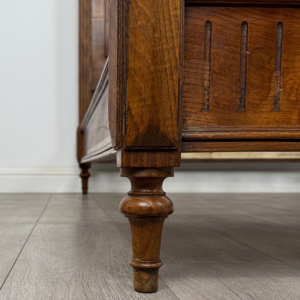 A 19th-century French oak double bed frame featuring a raised panelled headboard and footboard flanked by fluted posts with turned finials. View VIII