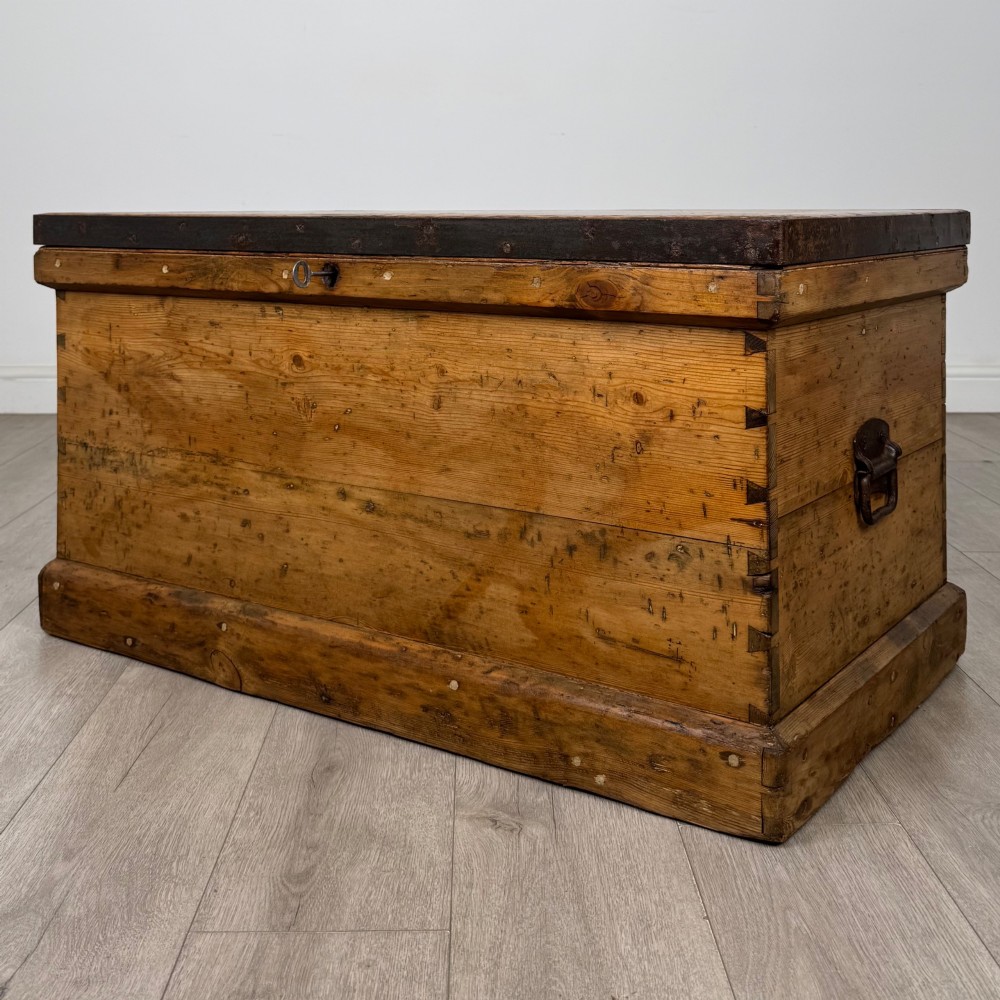 A nineteenth-century pine storage chest featuring visible hand-cut dovetail corner joints and a moulded base. View II