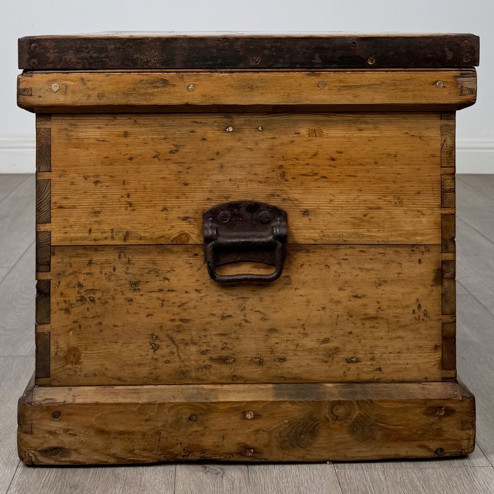 A nineteenth-century pine storage chest featuring visible hand-cut dovetail corner joints and a moulded base. View III