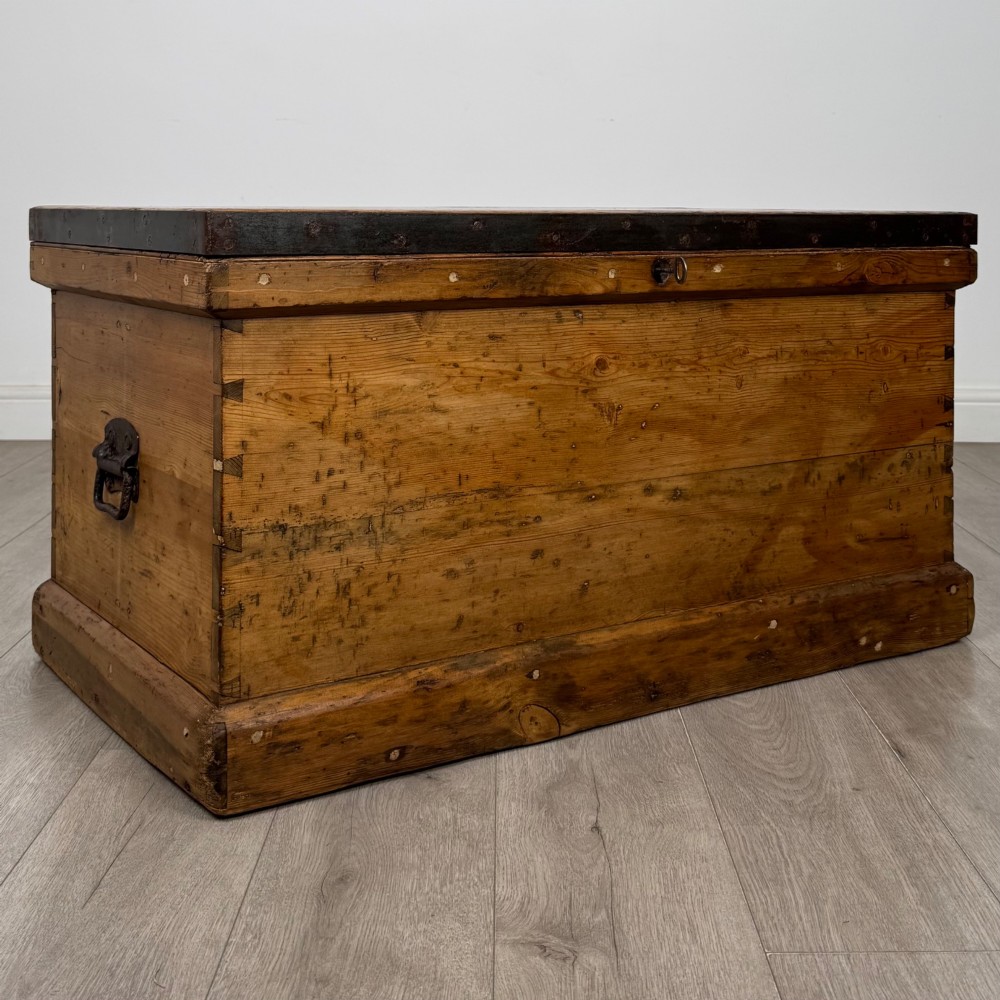 A nineteenth-century pine storage chest featuring visible hand-cut dovetail corner joints and a moulded base. View VIII