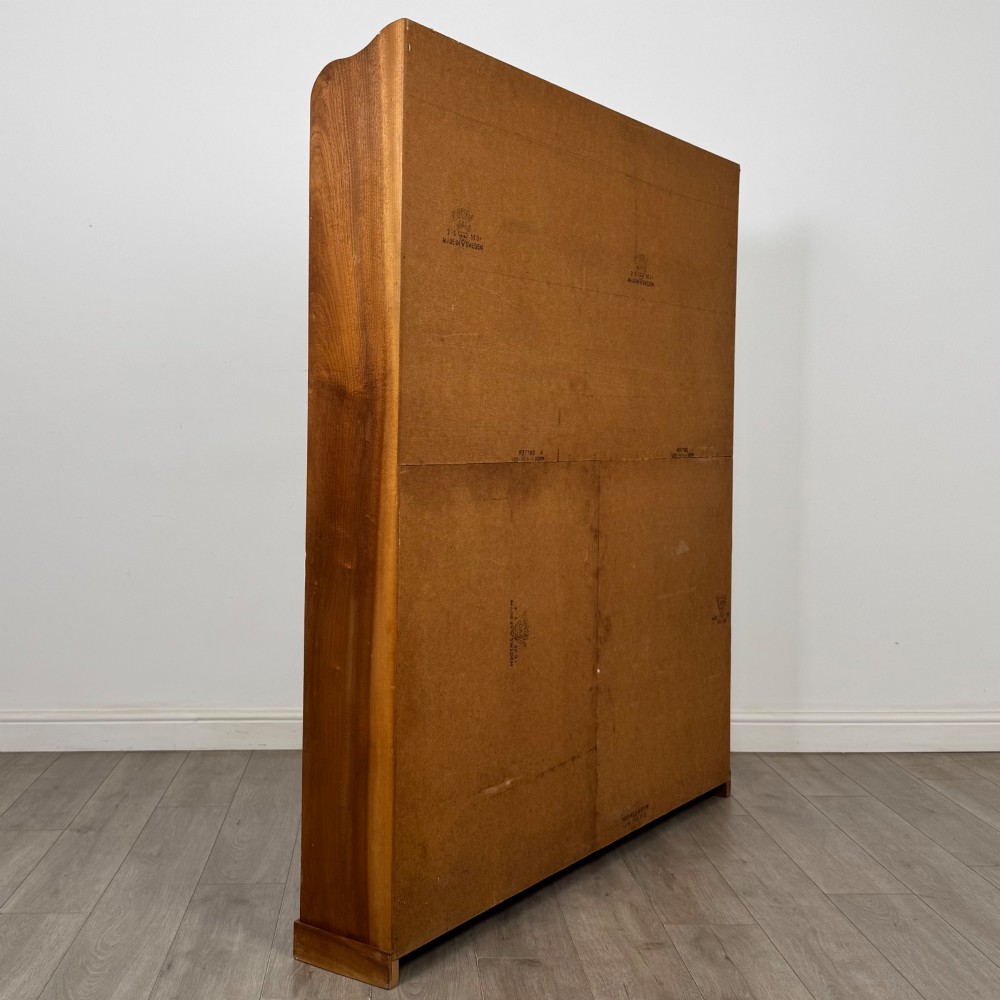 A large twentieth-century open walnut bookcase featuring multiple fixed shelves with a central divider on the lower section. View IV