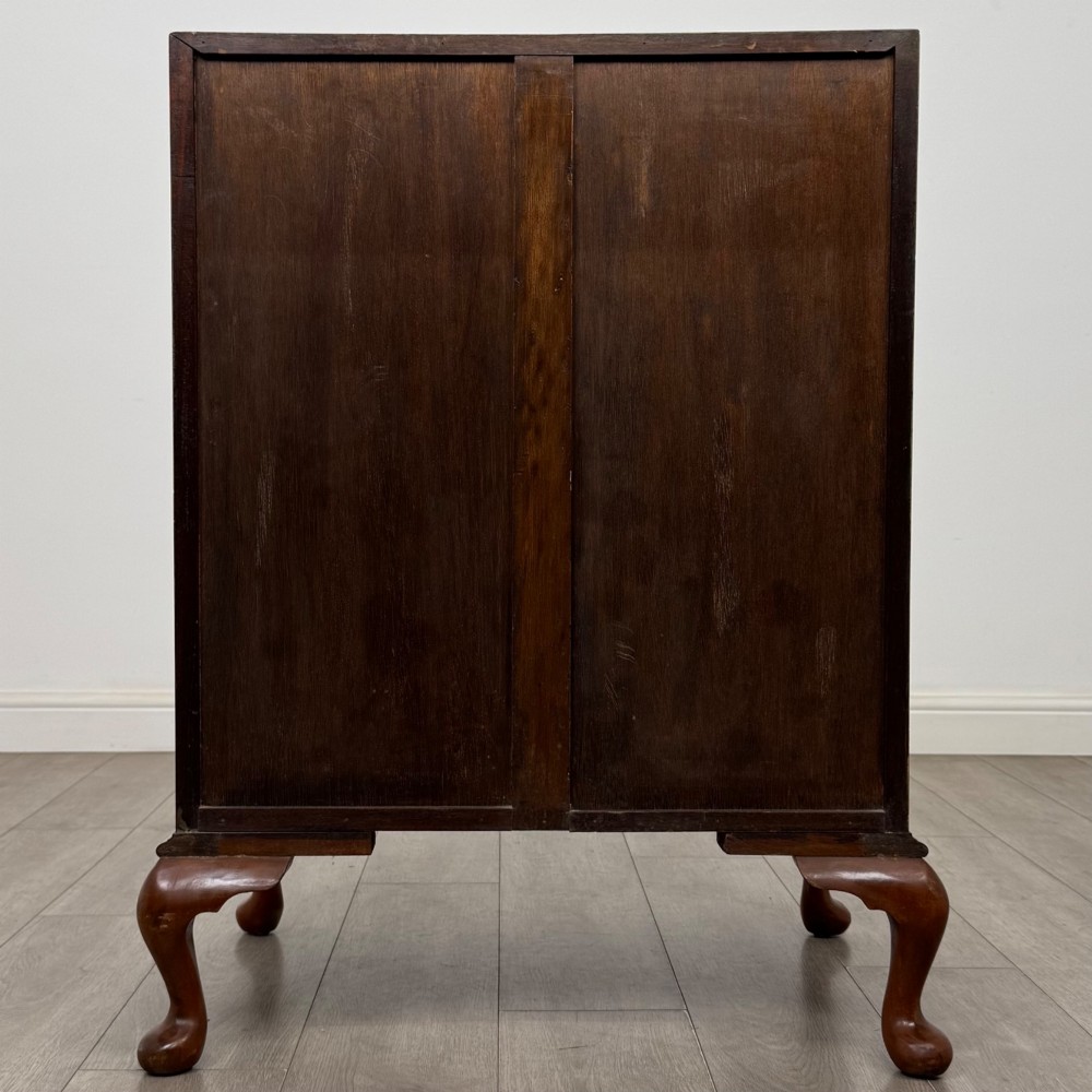 An Edwardian burr walnut writing bureau featuring a sloping fall front, three drawers with decorative brass handles, and cabriole legs. View VI