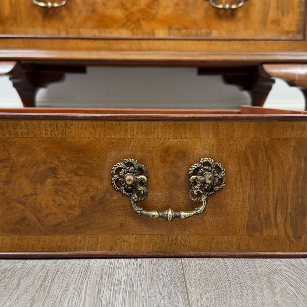 An Edwardian burr walnut writing bureau featuring a sloping fall front, three drawers with decorative brass handles, and cabriole legs. View XIII