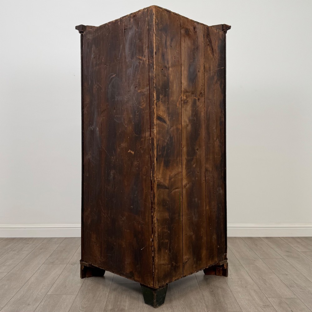 A tall 18th-century Georgian dark mahogany corner cabinet featuring panelled double doors, a moulded cornice, and bracket feet. View IV
