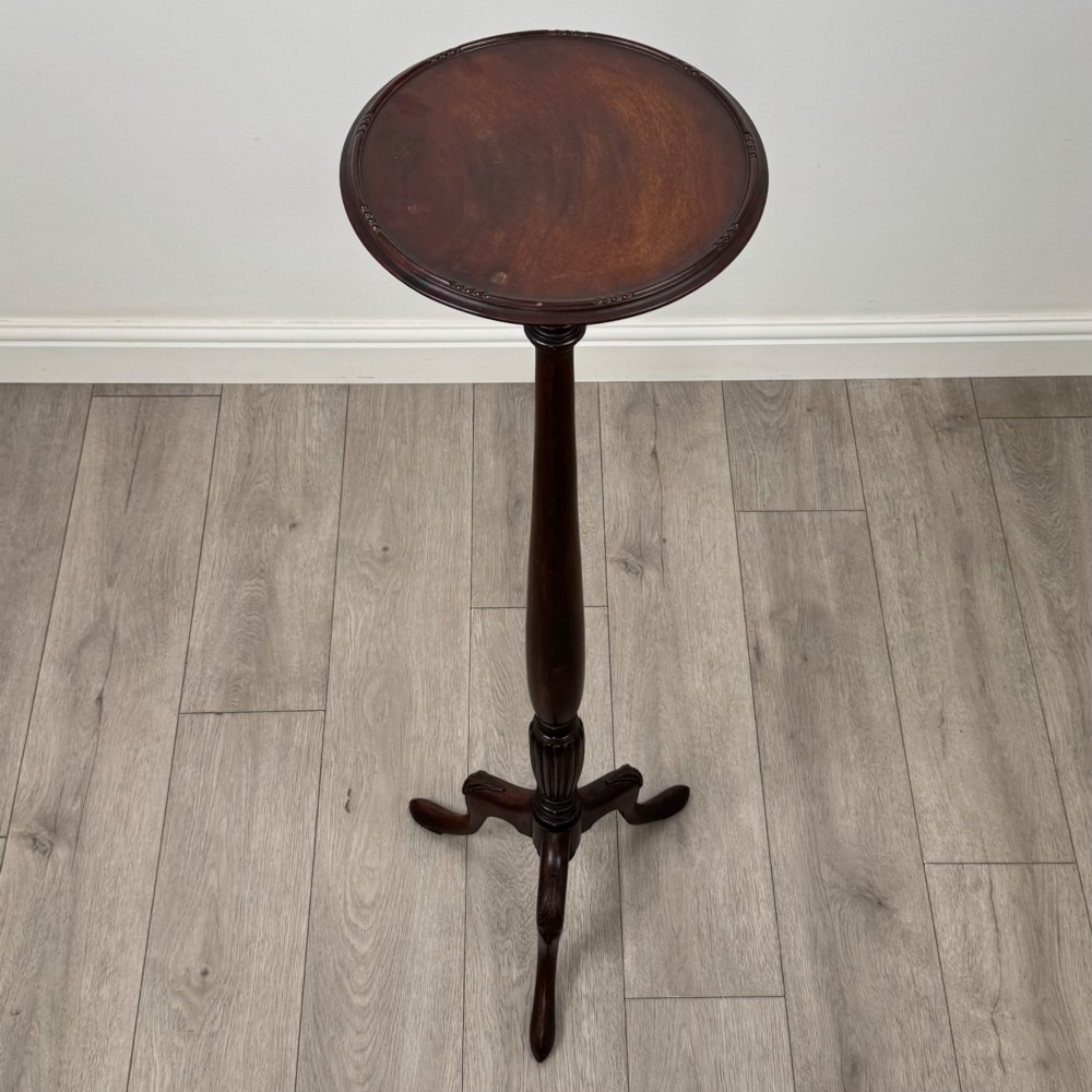 A tall 19th-century Georgian style mahogany torchere stand featuring a circular dished top, turned column, and carved tripod cabriole legs. View III