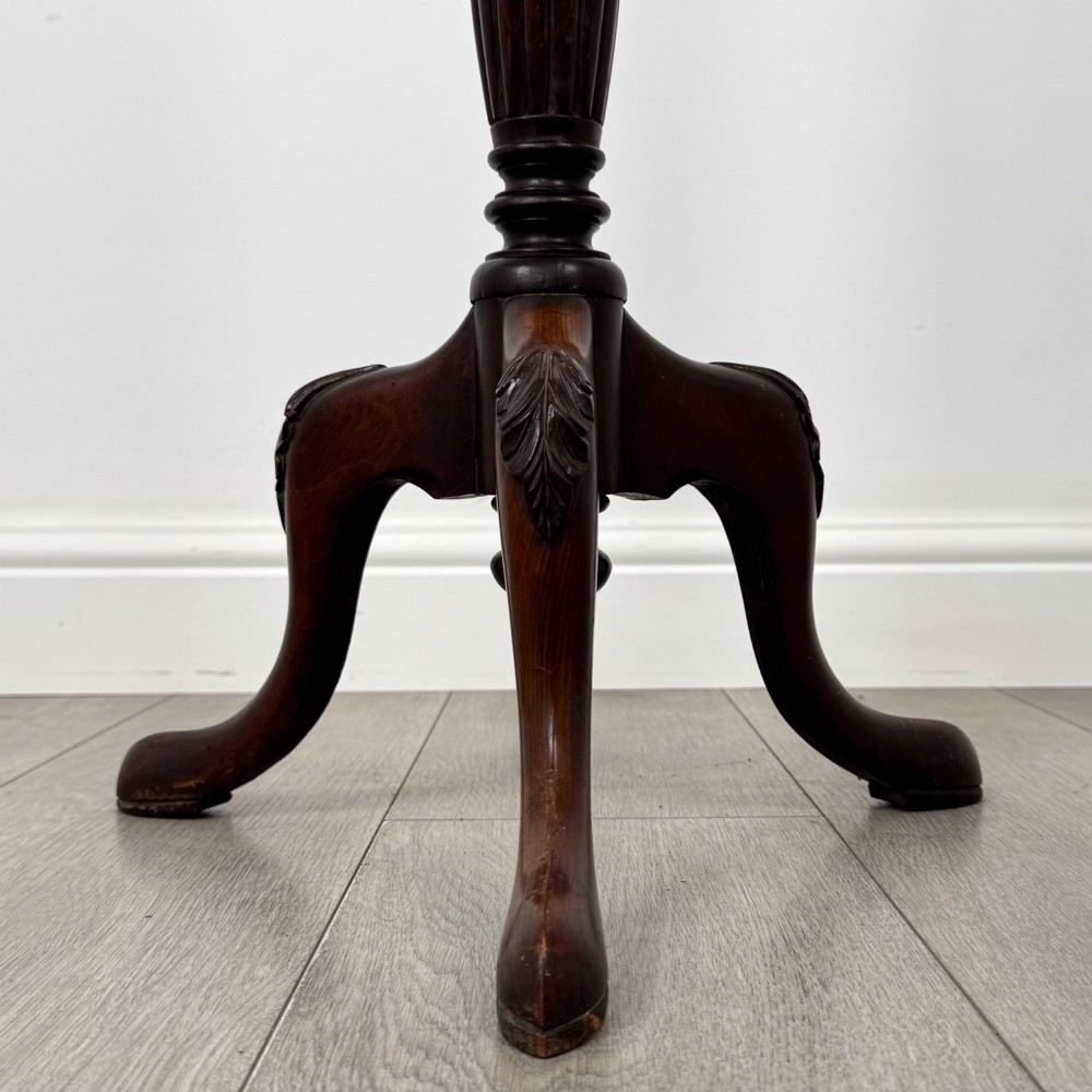 A tall 19th-century Georgian style mahogany torchere stand featuring a circular dished top, turned column, and carved tripod cabriole legs. View VI