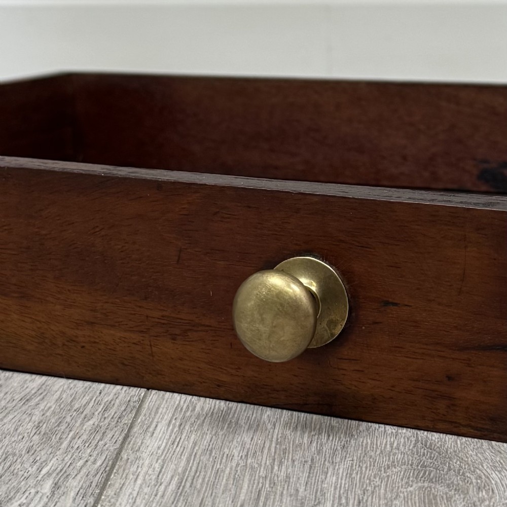 A Victorian mahogany writing table featuring two frieze drawers with brass knob handles, turned legs, and a low gallery back. View XI
