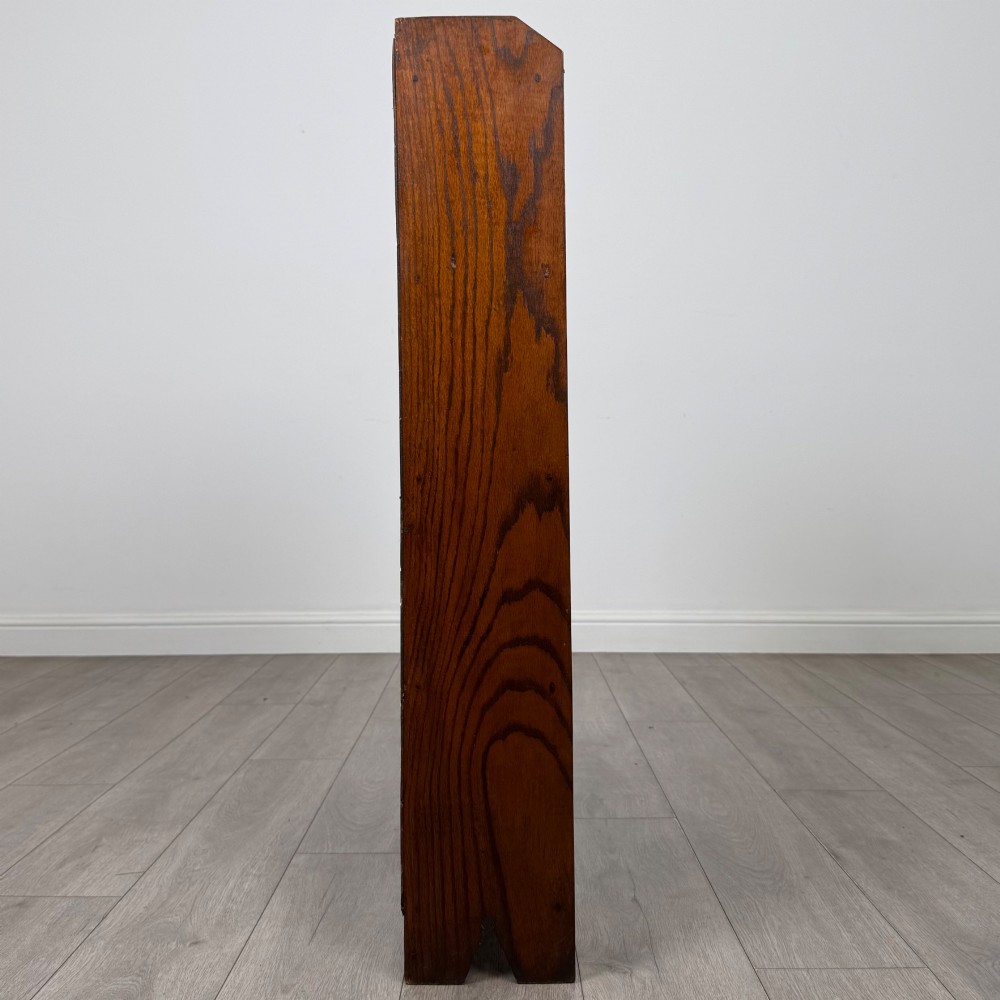 An Edwardian dark oak open bookcase featuring four fixed shelves and shaped side panels. View VIII