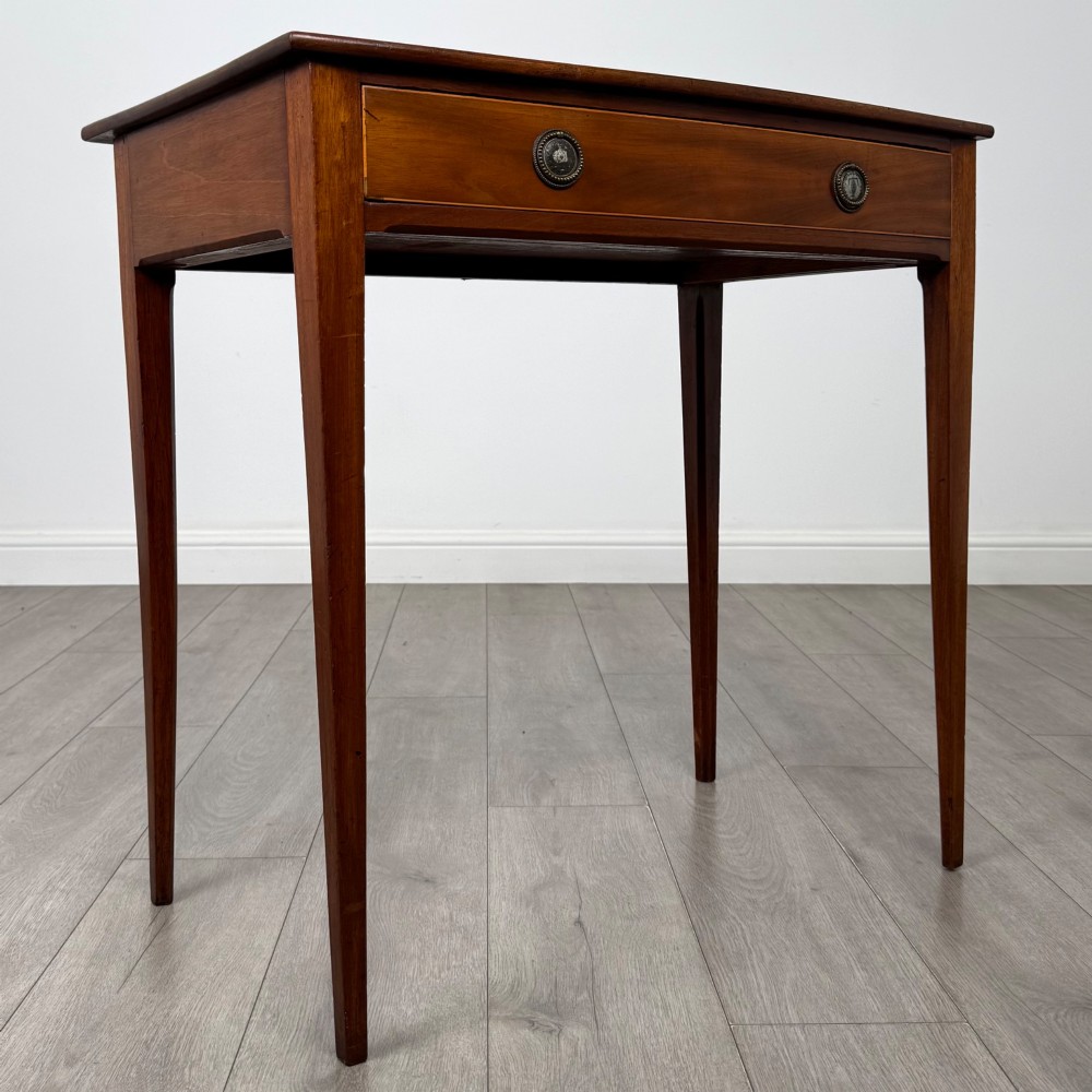 An 18th-century Georgian mahogany writing table featuring a single full-width drawer with two circular brass handles and tapered square legs. View VIII