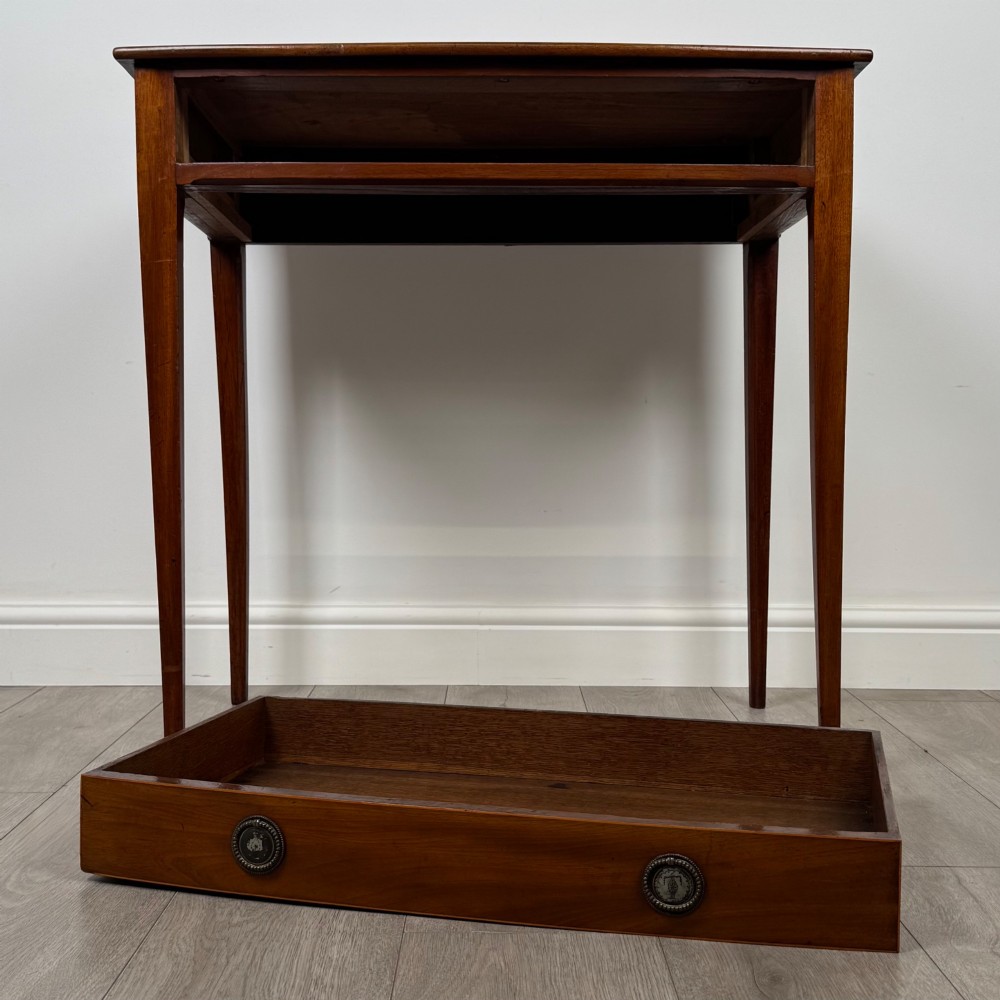 An 18th-century Georgian mahogany writing table featuring a single full-width drawer with two circular brass handles and tapered square legs. View X