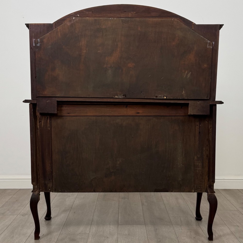 An antique Edwardian mahogany sideboard featuring a top section with a central oval mirror, two drawers, and a two-door cabinet below raised on cabriole legs. View VI