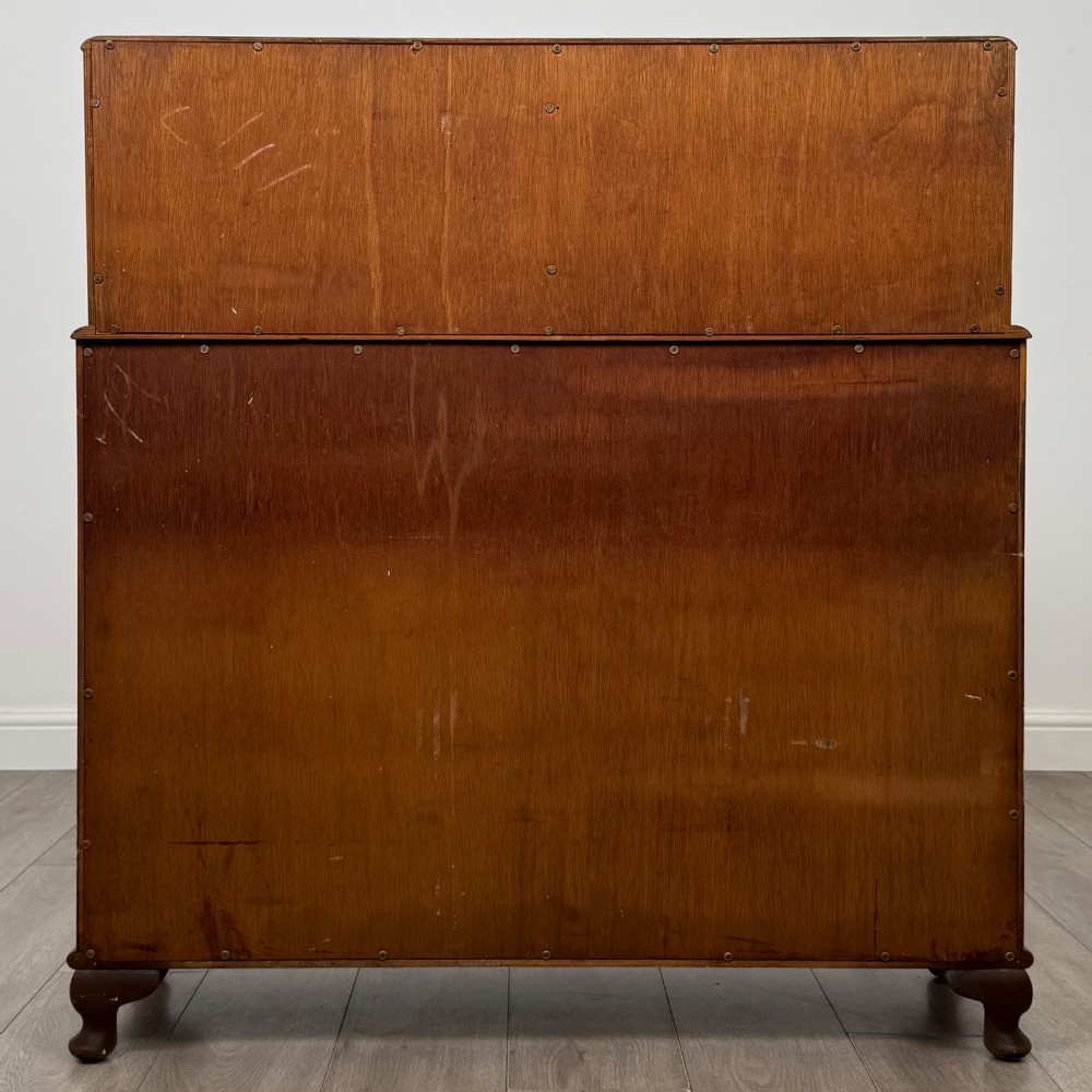 A 20th-century figured walnut fitted cabinet featuring upper solid doors above lower glazed doors with glass shelving. View VI