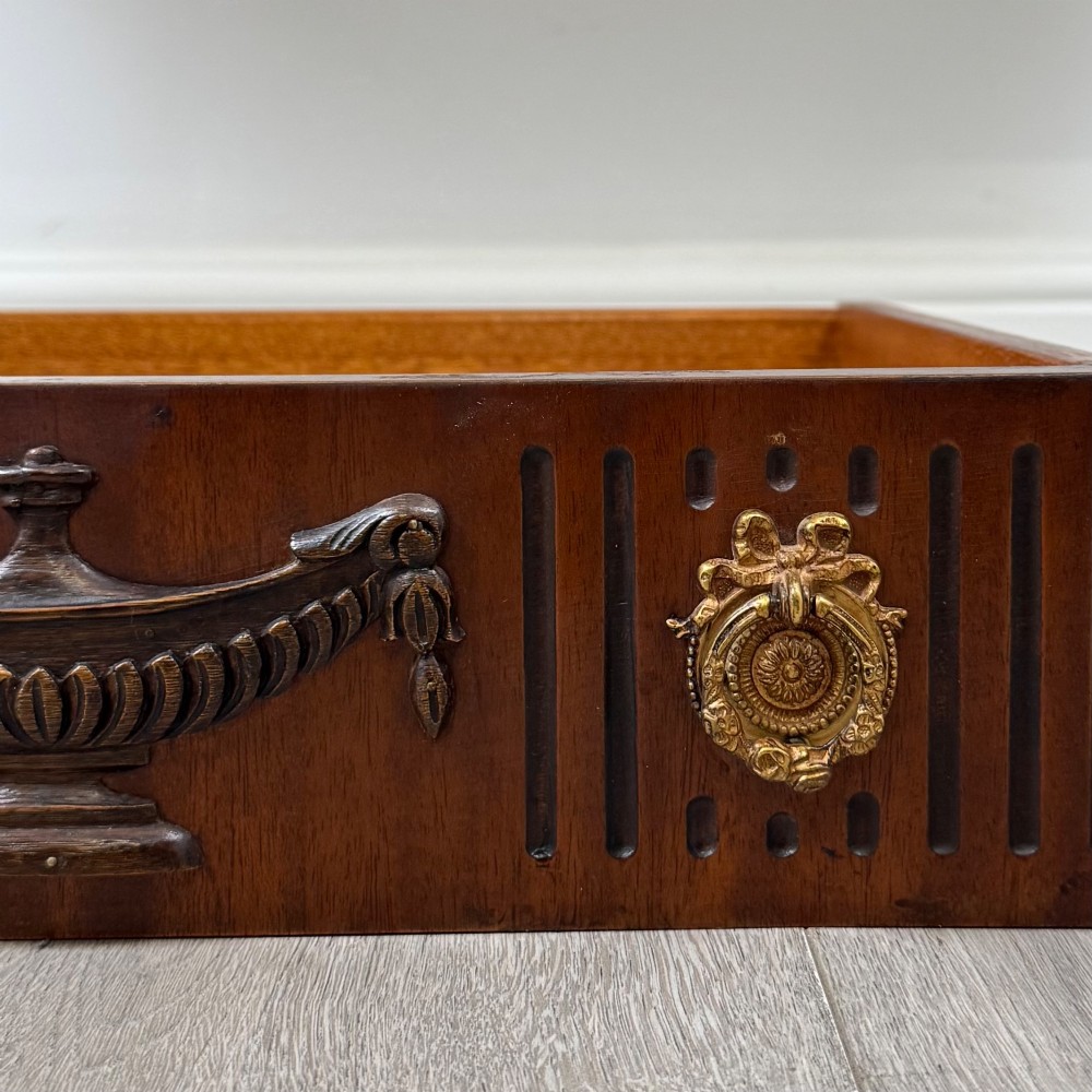 A dark mahogany 20th-century Adam style side table featuring a central carved urn motif, fluted frieze drawers, brass ring handles, and square tapered legs ending in spade feet. View XI