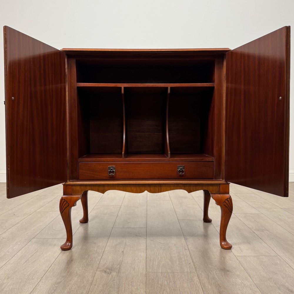 A 20th-century burr walnut two-door fitted cabinet on cabriole legs with carved shell knees and decorative pierced brass hinges. View II