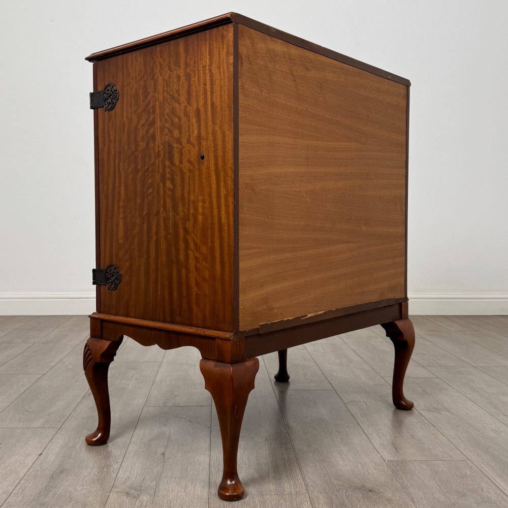 A 20th-century burr walnut two-door fitted cabinet on cabriole legs with carved shell knees and decorative pierced brass hinges. View V