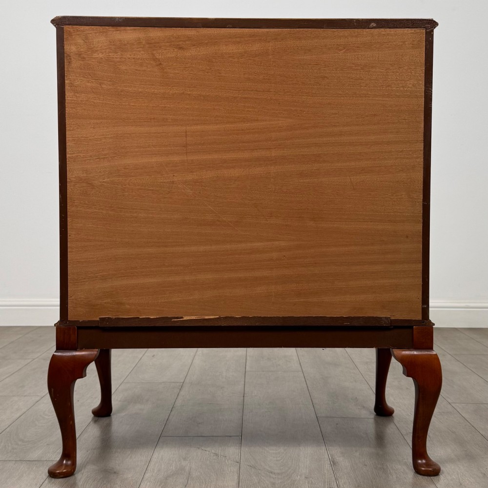 A 20th-century burr walnut two-door fitted cabinet on cabriole legs with carved shell knees and decorative pierced brass hinges. View VI