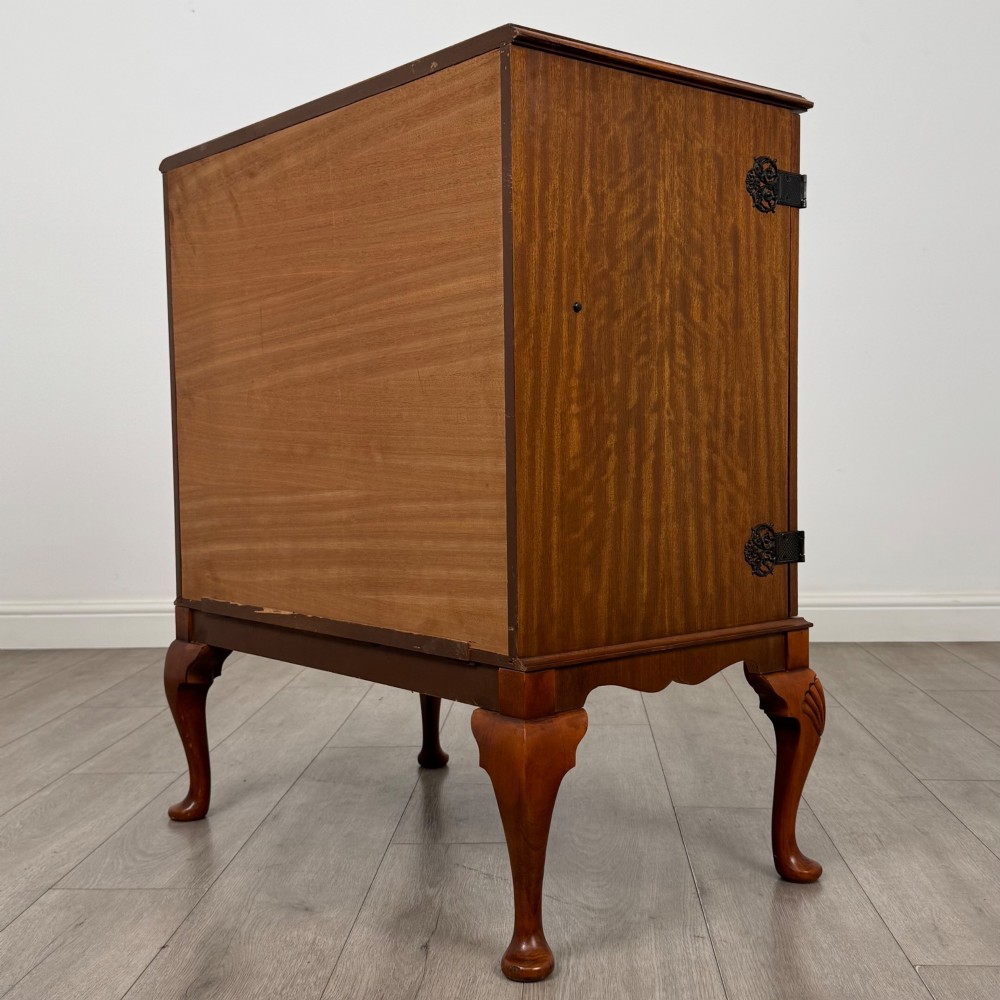 A 20th-century burr walnut two-door fitted cabinet on cabriole legs with carved shell knees and decorative pierced brass hinges. View VII