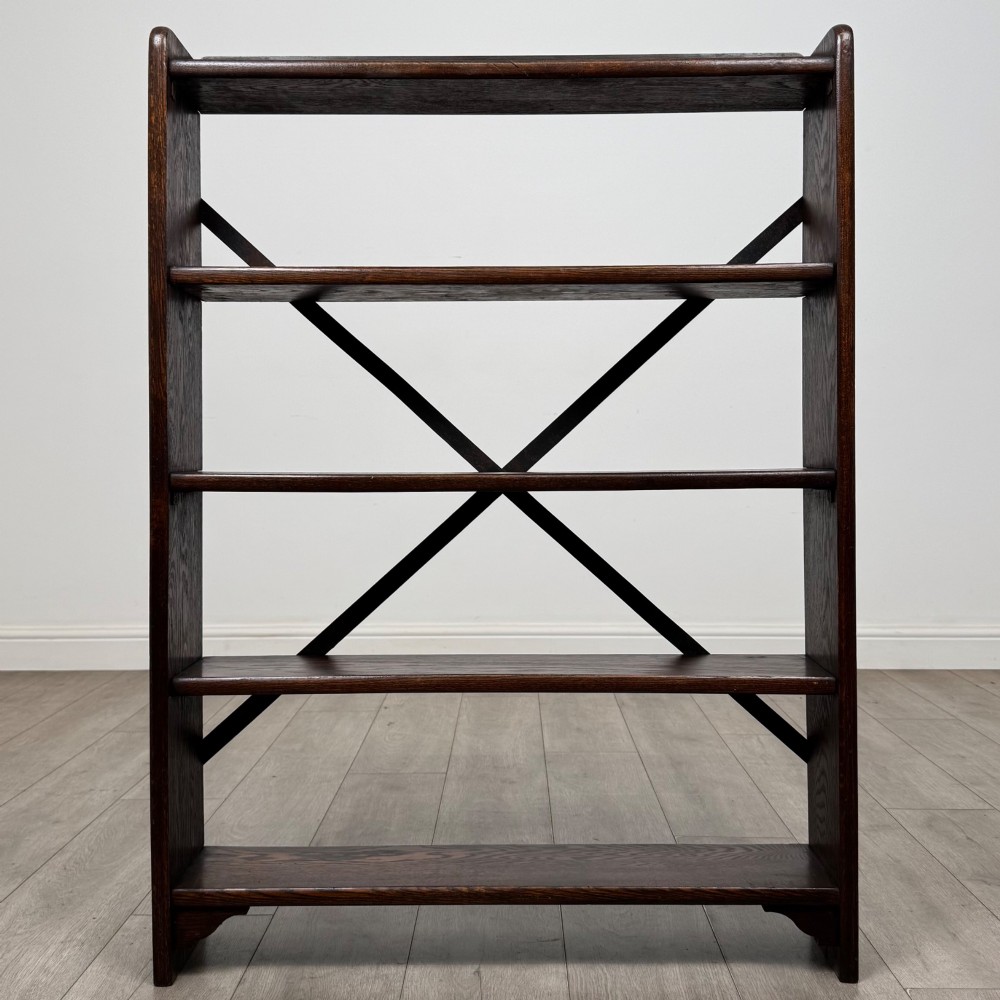 A dark oak open bookcase featuring five shelves and a black metal rear X-brace. View II