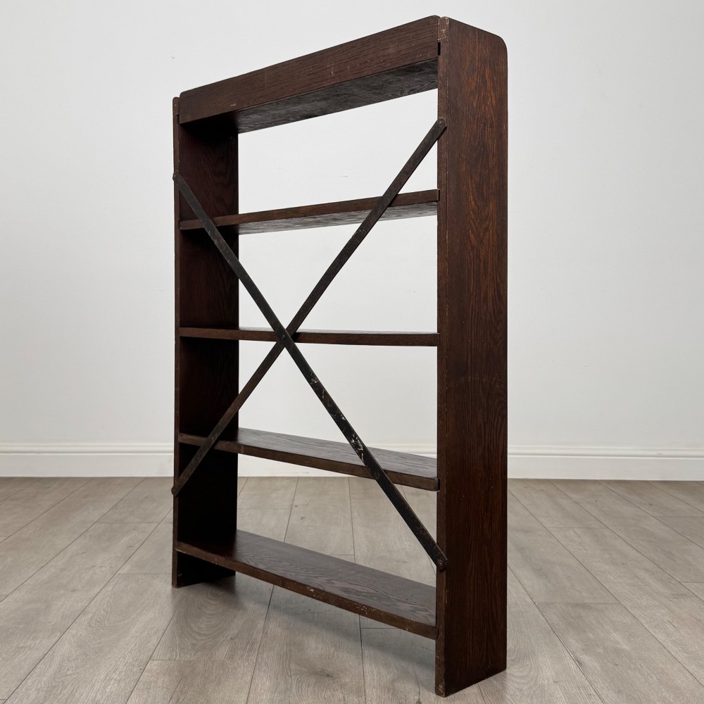 A dark oak open bookcase featuring five shelves and a black metal rear X-brace. View VII
