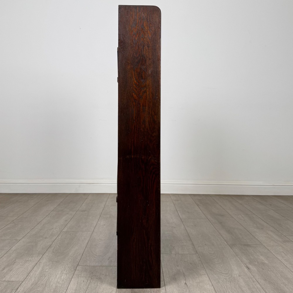 A dark oak open bookcase featuring five shelves and a black metal rear X-brace. View VIII
