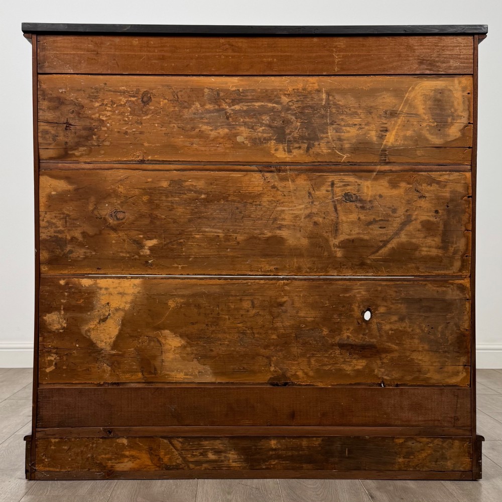 An antique 19th-century Victorian mahogany open bookcase featuring four tier shelves, rounded front corners, and a solid plinth base. View VI