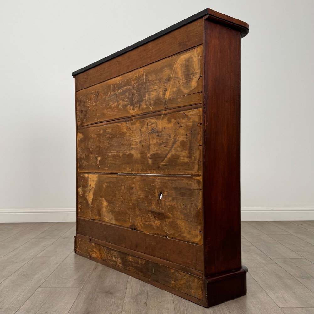 An antique 19th-century Victorian mahogany open bookcase featuring four tier shelves, rounded front corners, and a solid plinth base. View VII