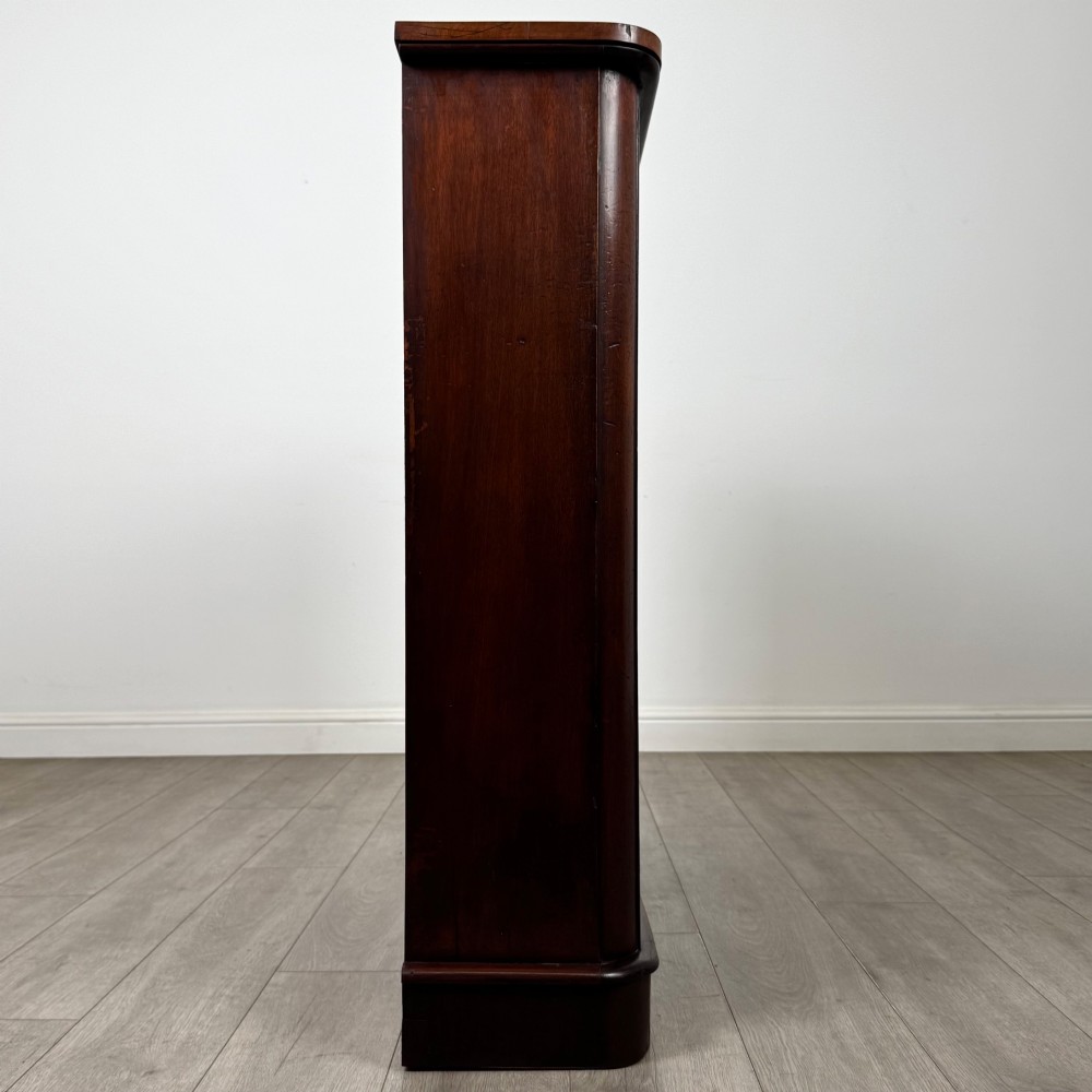 An antique 19th-century Victorian mahogany open bookcase featuring four tier shelves, rounded front corners, and a solid plinth base. View VIII