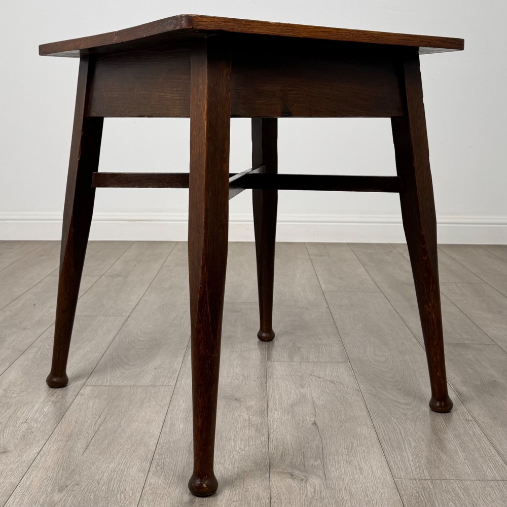 An antique dark oak Edwardian side table featuring four tapered legs, an X-shaped lower stretcher, and a square top surface. View VIII