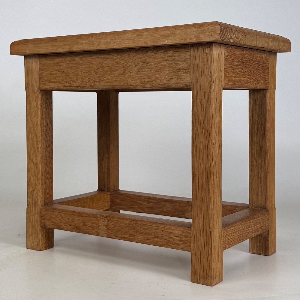 A solid oak rectangular joint stool featuring visible wooden dowel joinery and a sturdy base with lower stretchers. View II