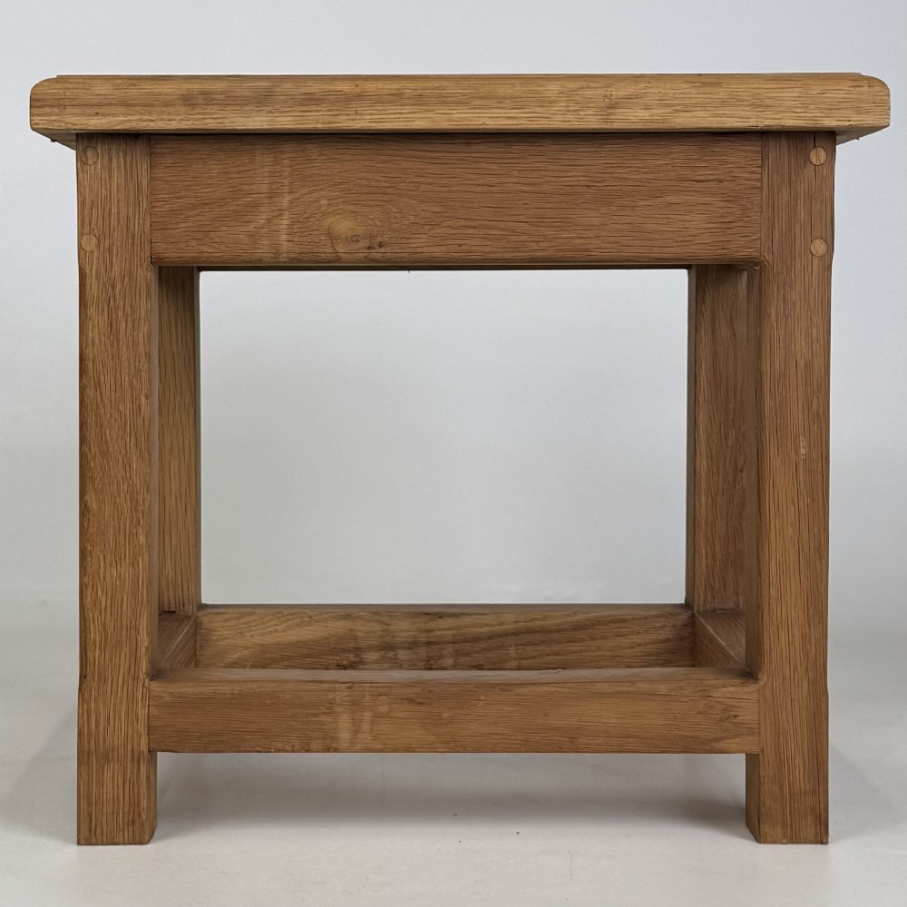 A solid oak rectangular joint stool featuring visible wooden dowel joinery and a sturdy base with lower stretchers. View V
