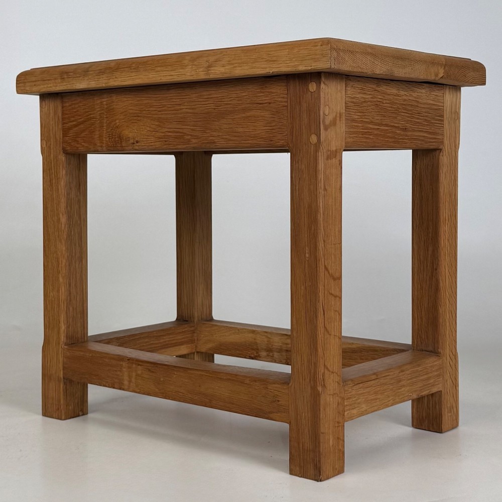 A solid oak rectangular joint stool featuring visible wooden dowel joinery and a sturdy base with lower stretchers. View VI