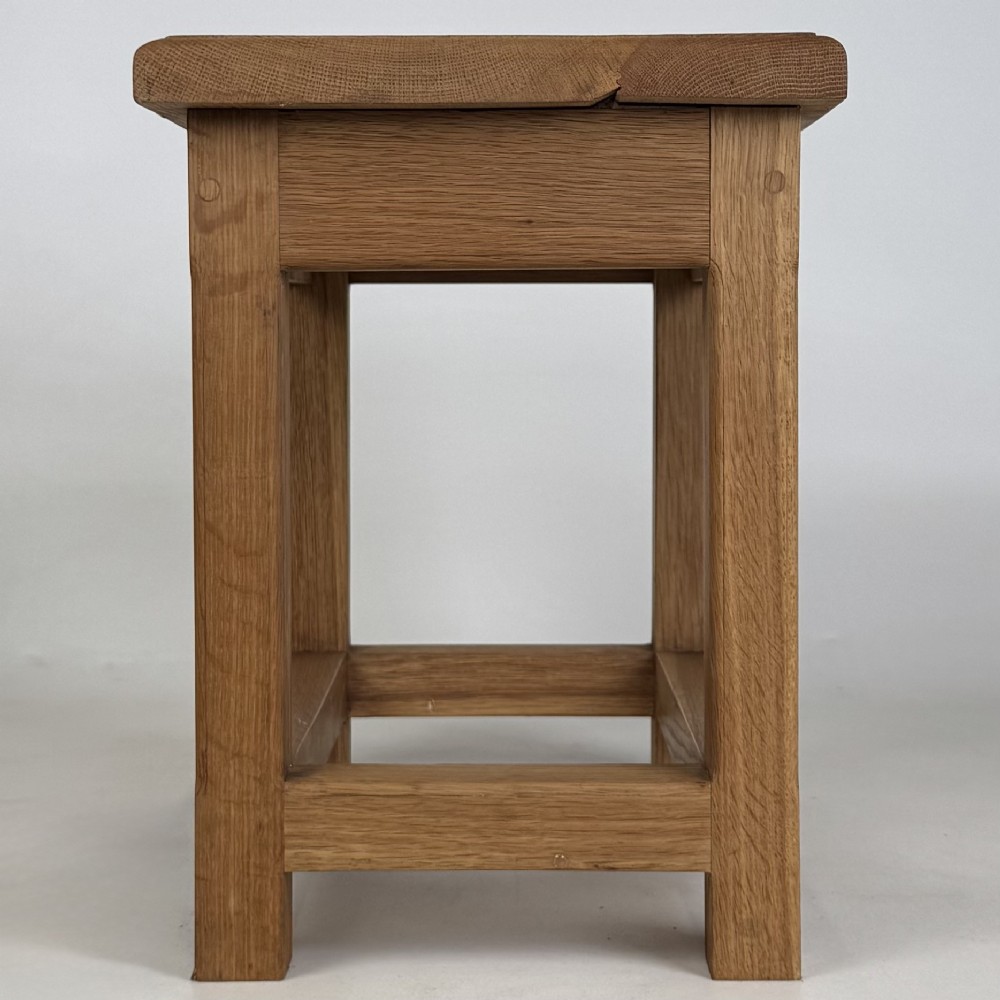 A solid oak rectangular joint stool featuring visible wooden dowel joinery and a sturdy base with lower stretchers. View VII